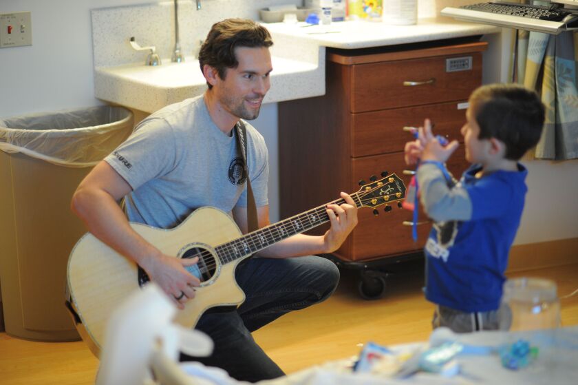 Musician on Call volunteers such as Phil Fensel are called upon to play everything from Megadeth to “Frozen” favorites, depending on what type of music a patient prefers.