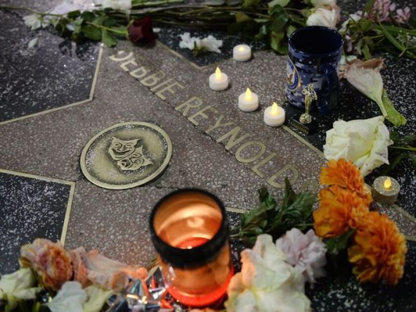 Flowers were placed on Debbie Reynolds’s live performance star on The Hollywood Walk of Fame shortly after her December death. (Photo: Kevork Djansezian, Getty Images)