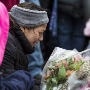 The family of Vicente Juarez, one of five people killed in a mass shooting at the Henry Pratt Company in Aurora, joins hundreds of mourners to pay their respects at a prayer vigil at the company, Sunday afternoon, Feb. 17, 2019. | Ashlee Rezin/Sun-Times