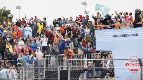 Fans cheer as the green flag is waved to start the race during the Grant Park 220 NASCAR Street Race, Sunday, July 2, 2023.
