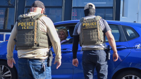 Agents yell order at a woman whose car they hit while chasing a man Tuesday morning in the 3100 block of West Lawrence Avenue June 2, 2026.
