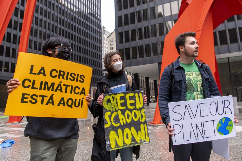 Around three dozen protesters rallied at Federal Plaza on Friday, April 22, 2022, demanding action to slow the effects of climate change.