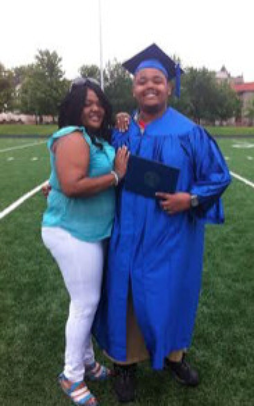 Xavier Gaines at his own high school graduation in 2013 with his mother, Nicky Reynolds.