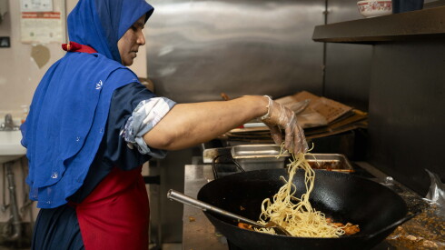 Toyouba Amir Ali, owner of Asian Homecook, prepares food at Asian Homecook in West Ridge.