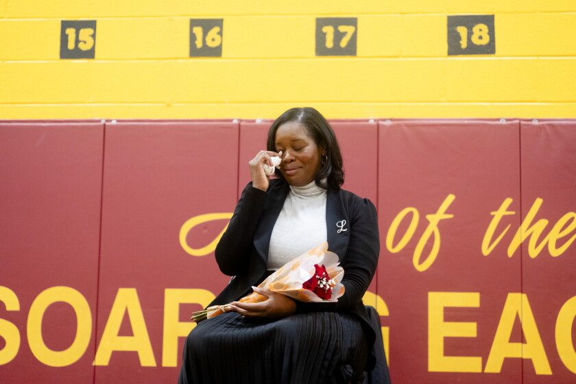 Earle STEM Elementary School Principal Regina Latimer-Lake, who was awarded the 2026 Elementary School Principal of the Year by the Illinois Principals Association, tears up Wednesday as she listens to testimonials about her at the Englewood school.