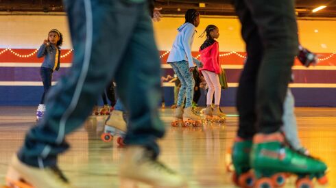 Kids roller skate during a family skate party and Black History Month skating event organized by Kido at The Rink in Chatham, Saturday, Feb. 25.