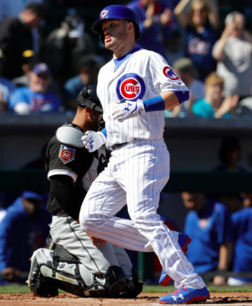 <em>Happ crosses plate after HR Tuesday.</em>