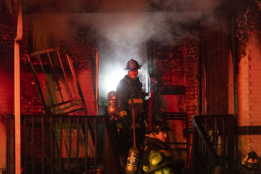 Chicago firefighters battle a house fire in the 5800 block of S. Peoria St., in the Englewood neighborhood, Monday, Dec. 7, 2020. | Tyler LaRiviere/Sun-Times