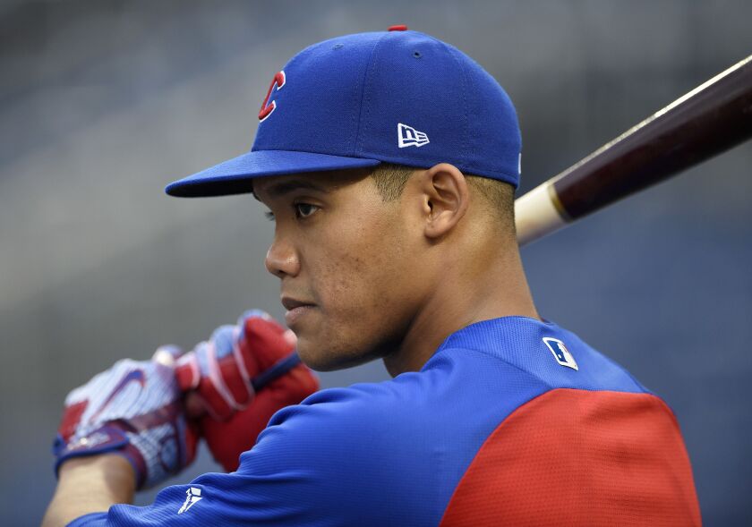 Addison Russell warms up.