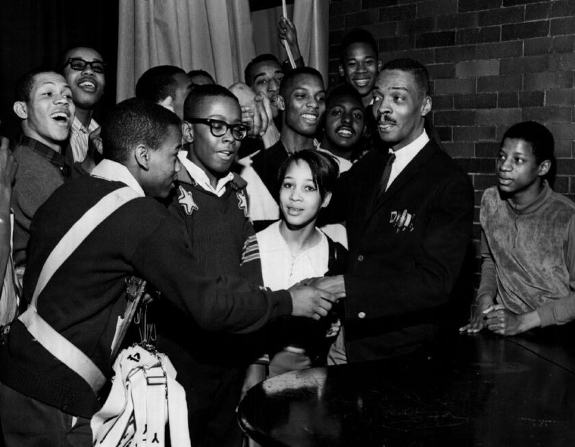 Radio personality Herb Kent is swamped by young fans at Farragut High School in February 1966, after they watched a movie, “Things Are Changing,” which Kent narrated. | Sun-Times Print Collection