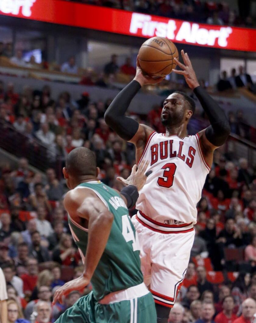 Bulls’ Dwyane Wade (3) shoots over Boston Celtics’ Al Horford during the first quarter of Game 3 of a first-round NBA basketball playoff series in Chicago, Friday, April 21, 2017. (AP Photo/Charles Rex Arbogast)