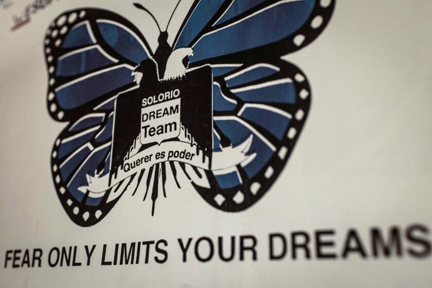 A poster with a blue butterfly reads "Solorio DREAM Team, fear only limits your dreams."
