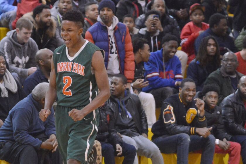 Morgan Park’s Charlie Moore (2) celebrates after dropping a three-pointer against North Lawndale.
