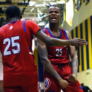 Curie’s Ramean Hinton (23) celebrates after hitting a shot and getting the and one against Simeon.