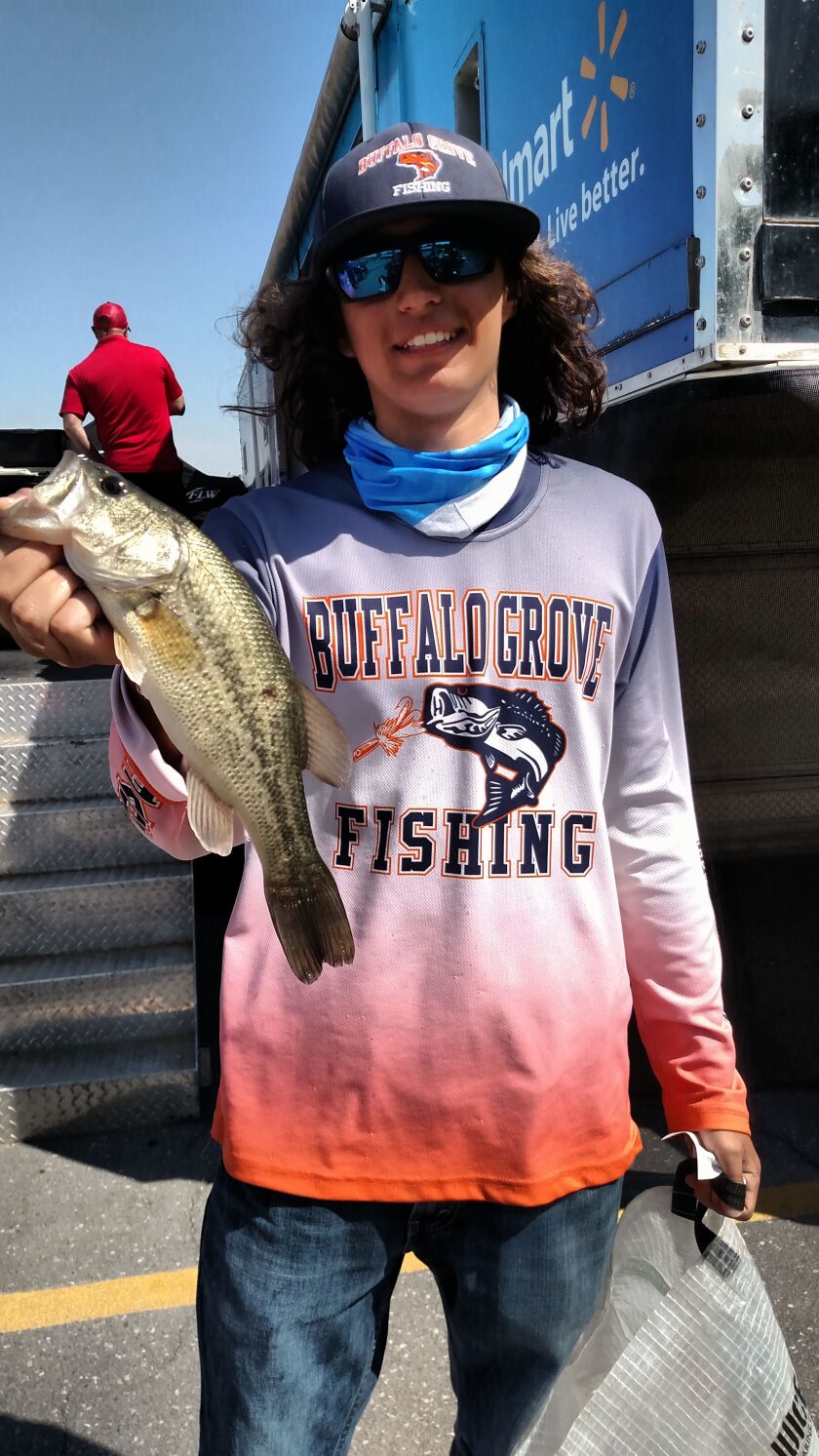 Tyler Lubbat with a largemouth bass last year (2016) at the IHSA state championship for bass fishing on Carlyle Lake.<br>Credit: Dale Bowman