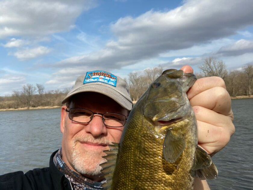 Charlie Mack with a Kankakee River smallmouth bass. Provided photo