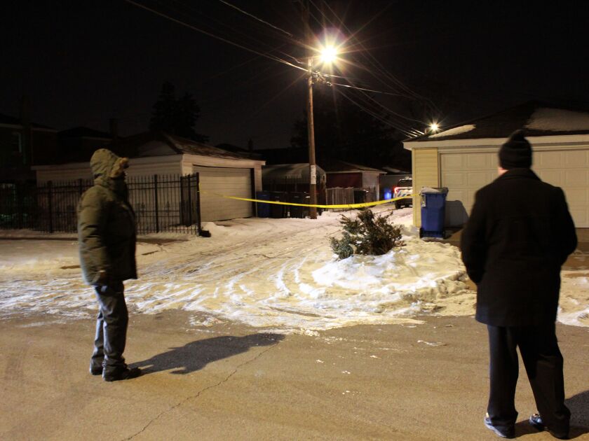 Chicago police investigate the scene where a woman was shot and killed, Friday morning, in the 10700 block of South Eberhart Avenue, in the Roseland neighborhood. | Justin Jackson/Sun-Times