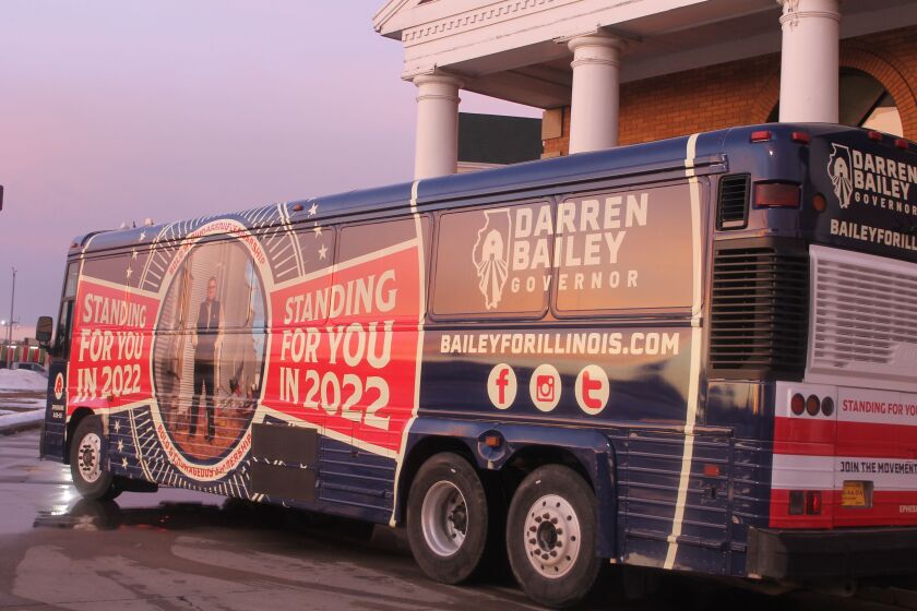 Republican Darren Bailey’s campaign bus sits outside the Thelma Keller Convention Center in Effingham on Monday.