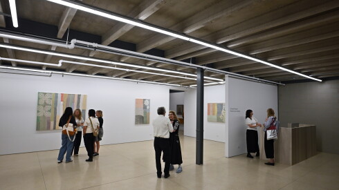 Art enthusiasts view textile paintings by Christy Matso at Volume Gallery during Chicago Exhibition Week.