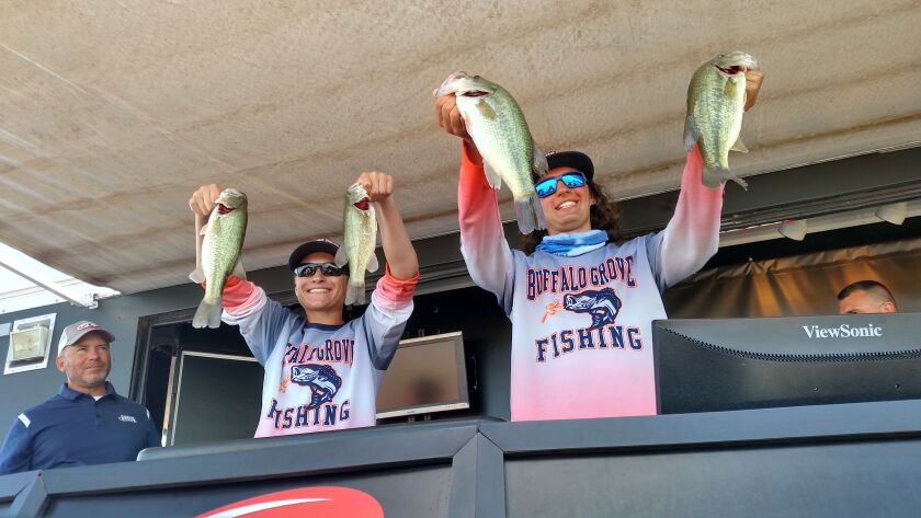 Dominic Domian and Tyler Lubbat lift their four keepers, which led Buffalo Grove to the state championship of bass fishing on Carlyle Lake.<br>Credit: Dale Bowman