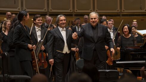 Riccardo Muti and pianist Yefim Bronfman acknowledge the audience applause after a performance of Brahms’ Piano Concerto No. 1 on Thursday night at Symphony Center.