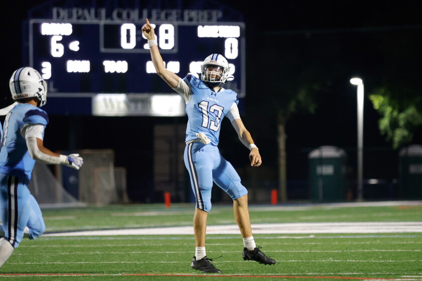 DePaul Prep's Andrew Campbell (13) celebrates after scoring a touchdown earlier this season against Lane.