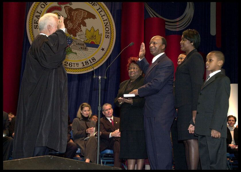 Doris Ivy (left) stands with her brother Secretary of State Jesse White, at his swearing-in. | Provided photo