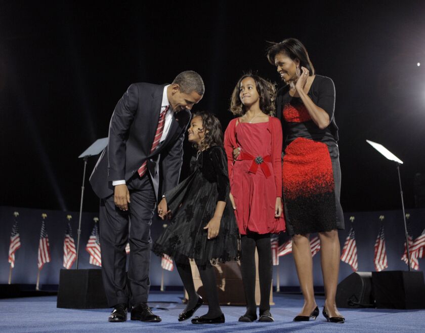President Obama, his wife Michelle Obama, and two daughters, Sasha and Malia, celebrate election night in 2008 in Grant Park in Chicago, where Obama’s career began. | Jae C. Hong/AP