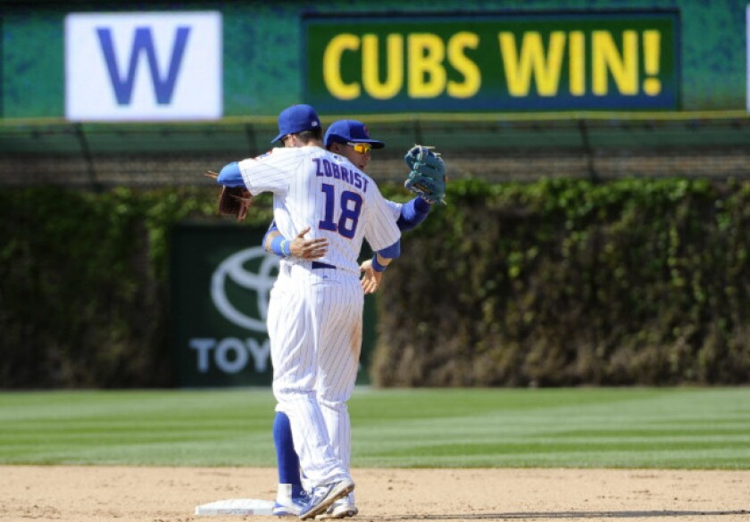 <em>Zobrist and Baez after a win last May</em>