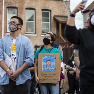 People gather for a vigil for 13-year-old Adam Toledo near the location of the shooting at West 24th Street and South Sawyer Avenue in Little Village, Monday afternoon, April 5, 2021. Toledo was fatally shot in the chest by a Chicago police officer in an alley west of the 2300 block of South Sawyer Avenue near Farragut Career Academy High School.