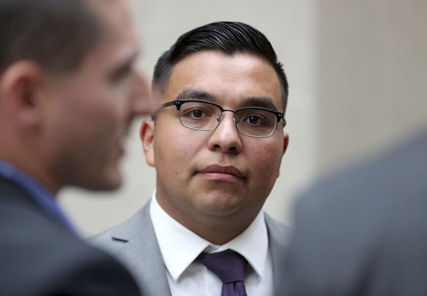 In this May 30 file photo, St. Anthony<br>Police Officer Jeronimo Yanez stands outside the Ramsey County Courthouse | David Joles/Star Tribune via AP