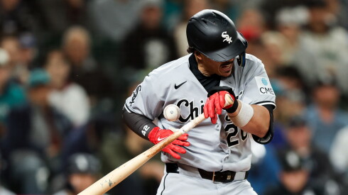 The White Sox' Miguel Vargas is hit by a pitch in the ninth inning Tuesday in Seattle.