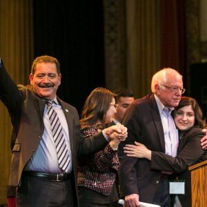 (From left to right) Cook County Commissioner Jesus “Chuy” Garcia, Alma Anaya, candidate for Cook County Commissioner, U.S. Sen. Bernie Sanders and Delia Ramirez, candidate for Illinois sate representative, wave to the crowd after Sanders head