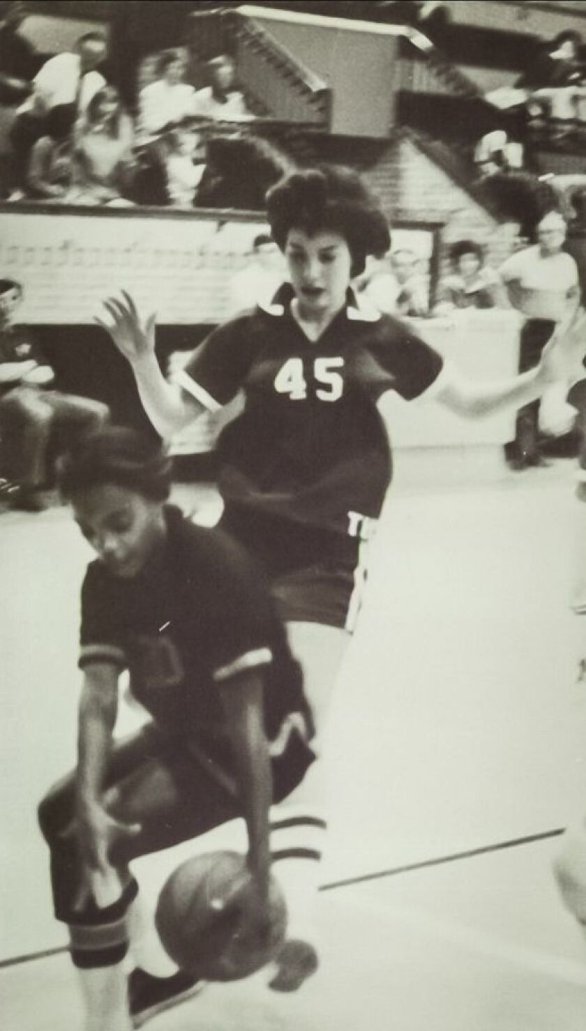Lori Lightfoot (left) playing on her high school basketball team in Massillon, Ohio. | Yearbook