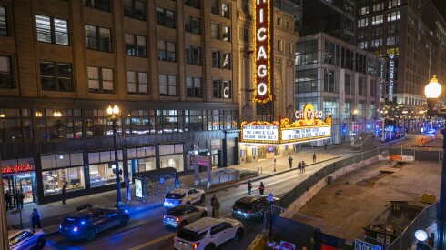Chicago police investigate the scene where multiple people were shot outside the Chicago Theatre in The Loop, Friday, Nov. 21, 2025.