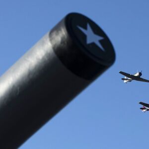 World War II era T-6 Texan trainer aircraft flyover The Battleship New Jersey Museum and Memorial. | AP Photo