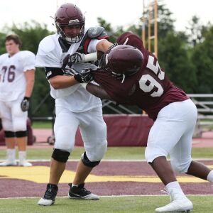 Loyola’s Peter Gianaris (60) blocks during a practice.