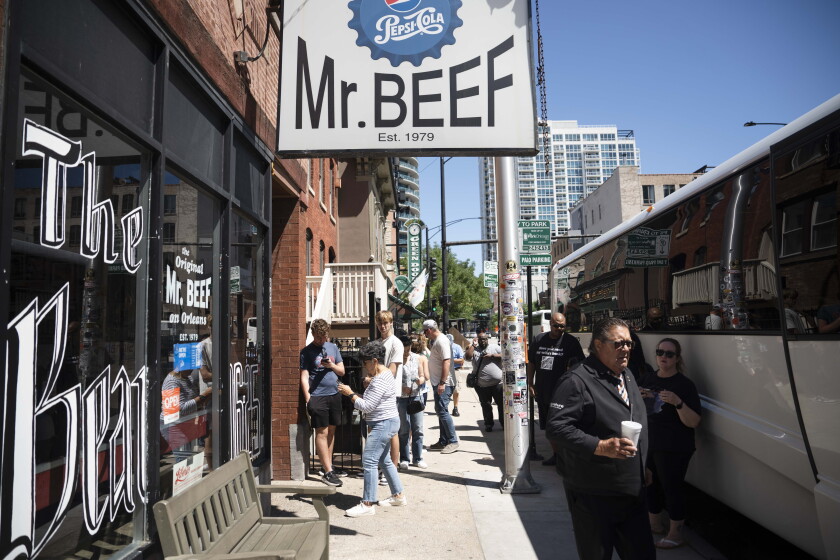 People who are part of the “Yes Chef” tour take pictures outside Mr. Beef, Saturday, June 13, 2026. | Pat Nabong/Sun-Times