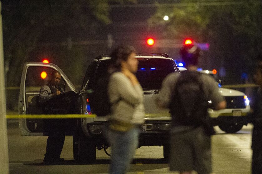 Police investigate a person shot Tuesday morning in the 600 block of East 76th. | Tyler LaRiviere/Sun-Times