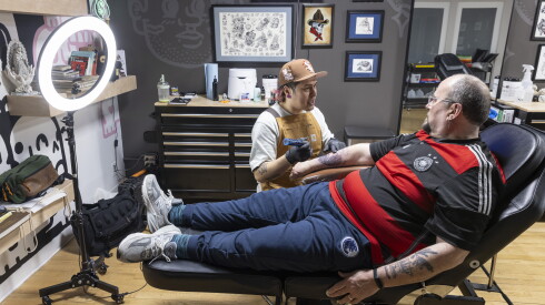 Tattoo artist Orlando Camacho is a cousin of Steven Bruehl's partner, Cesar Barradas.