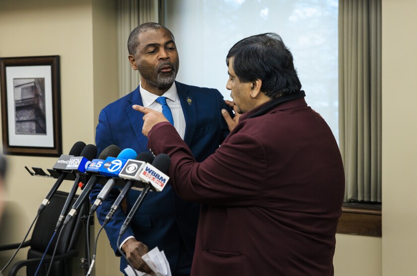 State Rep. La Shawn K. Ford (left) speaks with Resilience Healthcare CEO Manoj Prasad during a news conference Wednesday to explain the financial situation at West Suburban Medical Center in Oak Park and discuss the hospital's temporary closure and plans to try to reopen it.