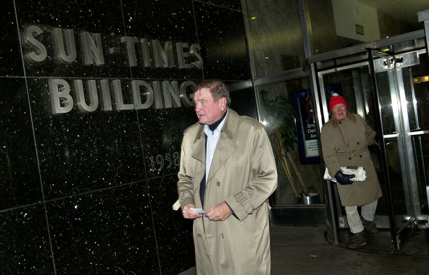 Former Rep. Dan Rostenkowski leaves the old Sun-Times building after taping a segment for FOX News in their studio hours after President Bill Clinton pardoned him in December of 2000. File Photo.