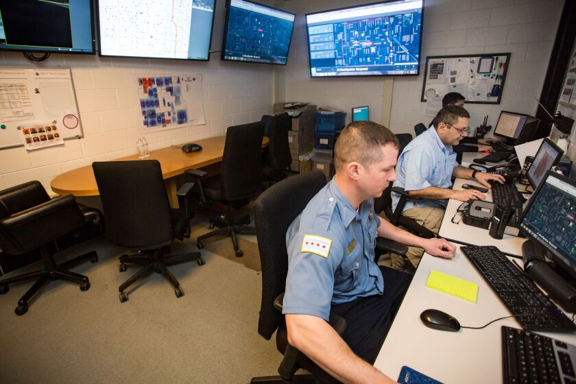 Police officers in the Englewood district’s strategic decision support center in January 2018.