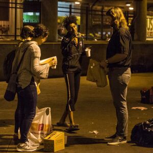 Activists and faith leaders give doughnuts and coffee to the homeless as they begin to pack their belongings in lieu of the deadline that residents of “The Triangle” were given to evacuate the area by the city of Chicago, Monday, June 11, 2018