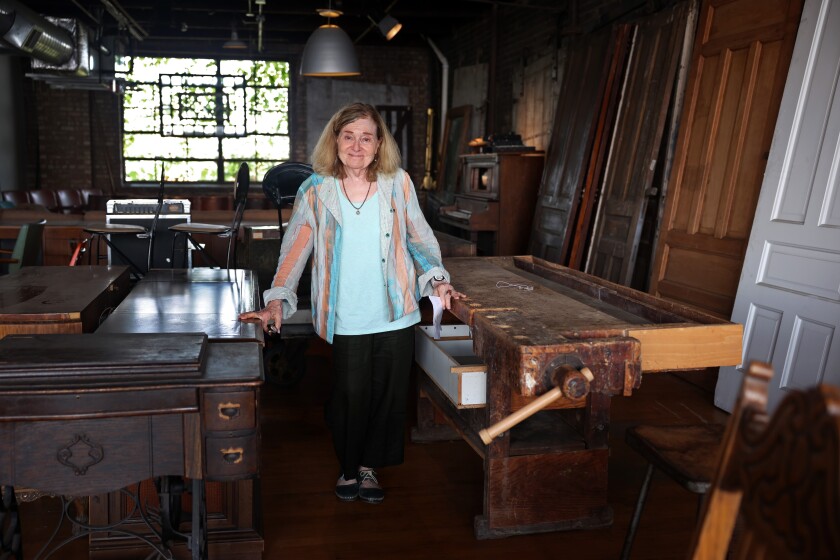 Jane Rodak, Owner of Salvage One, Stands Next to a Chippie's Bench Feeble in the Drawing near Netflix Checklist