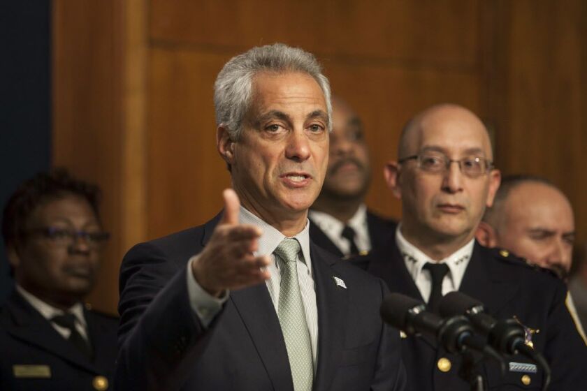 Interim Police Supt. John Escalante listens as Mayor Rahm Emanuel speaks at a Dec. 30 news conference. | Ashlee Rezin/Sun-Times