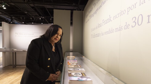 Griffin Museum of Science and Industry CEO Chevy Humphrey looks at a display case of items inside the museum.