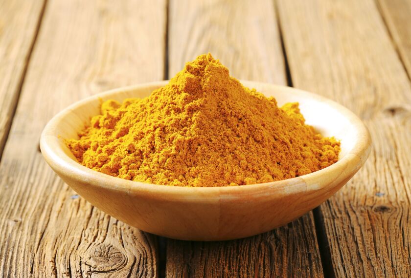 Finely ground curry powder mixed with warm, melted butter and honey creates the perfect caramel-like drizzle to add to your popcorn.