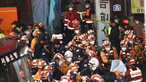 Emergency services treat injured people after a stampede on October 30, 2022 in Seoul, South Korea.