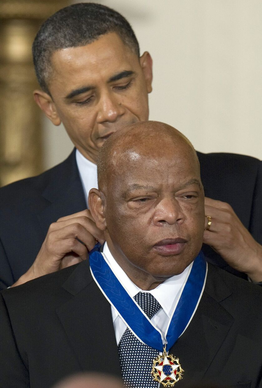 President Barack Obama awards the 2010 Medal of Freedom to U.S. Rep. John Lewis, D-Ga, during a ceremony at the White House on Feb. 15, 2011.